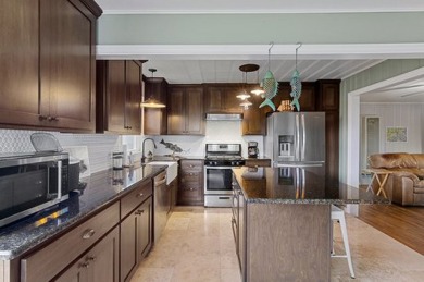 Ride your golf cart to dining, the beach, and downtown from this on Rockport Country Club in Texas - for sale on GolfHomes.com, golf home, golf lot