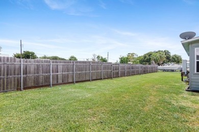Ride your golf cart to dining, the beach, and downtown from this on Rockport Country Club in Texas - for sale on GolfHomes.com, golf home, golf lot