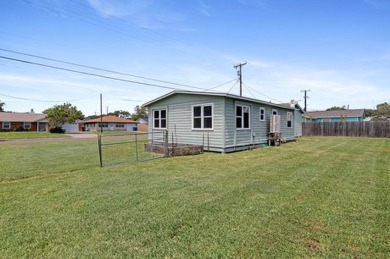 Ride your golf cart to dining, the beach, and downtown from this on Rockport Country Club in Texas - for sale on GolfHomes.com, golf home, golf lot