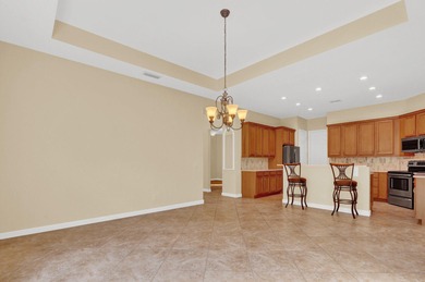 Located in PGA Village--truly a golfer's paradise--this very on The Legacy Golf and Tennis Club in Florida - for sale on GolfHomes.com, golf home, golf lot