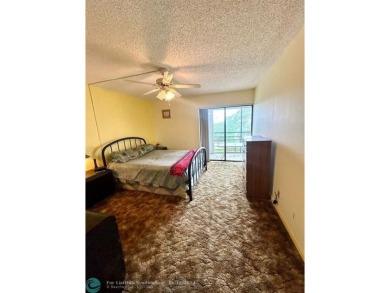 2-bedroom 2-bathroom condo located in the sought out all age's on Palm-Aire Country Club and Resort - Palms in Florida - for sale on GolfHomes.com, golf home, golf lot