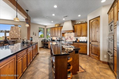 Luxury estate nestled at the end of a cul-de-sac and backing on Antelope Hills Golf Courses in Arizona - for sale on GolfHomes.com, golf home, golf lot