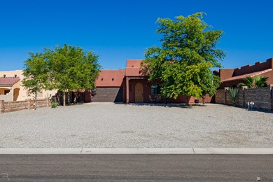 Tucked away in Yuma's South Foothills, this Santa Fe-style home on Las Barrancas Golf Course in Arizona - for sale on GolfHomes.com, golf home, golf lot