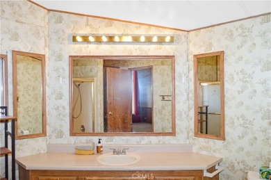 Welcome Home to 10765 Chisholm Trail in Cherry Valley! If you're on Highland Springs Village Golf Course in California - for sale on GolfHomes.com, golf home, golf lot