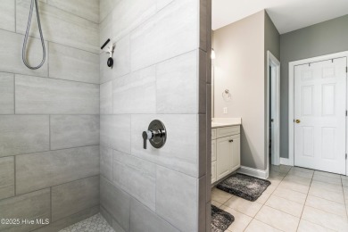 This charming, well maintained 4BR/3BA is located on a quiet on Carolina National Golf Club in North Carolina - for sale on GolfHomes.com, golf home, golf lot