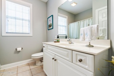 This charming, well maintained 4BR/3BA is located on a quiet on Carolina National Golf Club in North Carolina - for sale on GolfHomes.com, golf home, golf lot