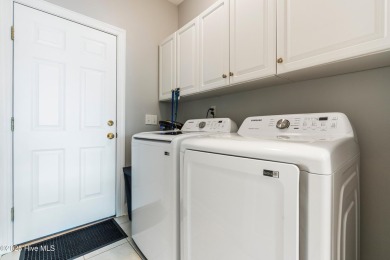 This charming, well maintained 4BR/3BA is located on a quiet on Carolina National Golf Club in North Carolina - for sale on GolfHomes.com, golf home, golf lot