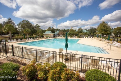 This charming, well maintained 4BR/3BA is located on a quiet on Carolina National Golf Club in North Carolina - for sale on GolfHomes.com, golf home, golf lot