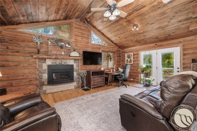 Escape to your own private sanctuary in this quaint log home on on The Briarwood in Montana - for sale on GolfHomes.com, golf home, golf lot