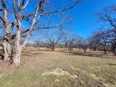 Just under an acre building site lot with mature oak trees  to on Nocona Hills Golf Course in Texas - for sale on GolfHomes.com, golf home, golf lot