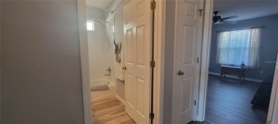 MOVE IN READY - UPGRADED - TURNKEY -GOLF CART INCLUDED- NO BOND on The Links of Spruce Creek in Florida - for sale on GolfHomes.com, golf home, golf lot