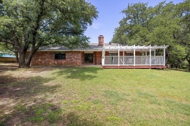 Classy and classic ranch style house nestled in Pecan Plantation on Pecan Plantation Country Club in Texas - for sale on GolfHomes.com, golf home, golf lot