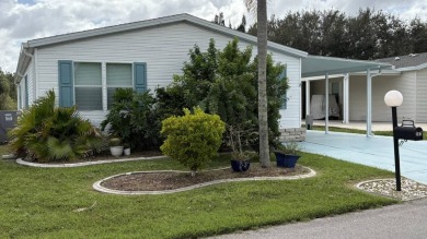 This home has so much to offer!  Pull up to an extended driveway on Sabal Springs Golf and Racquet Club in Florida - for sale on GolfHomes.com, golf home, golf lot