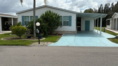 This home has so much to offer!  Pull up to an extended driveway on Sabal Springs Golf and Racquet Club in Florida - for sale on GolfHomes.com, golf home, golf lot