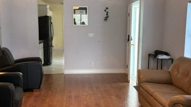 This home has so much to offer!  Pull up to an extended driveway on Sabal Springs Golf and Racquet Club in Florida - for sale on GolfHomes.com, golf home, golf lot