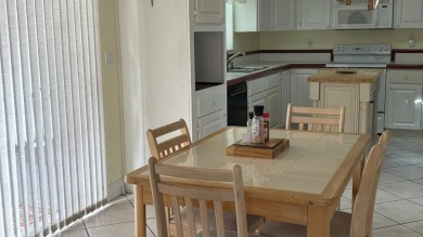 This home has so much to offer!  Pull up to an extended driveway on Sabal Springs Golf and Racquet Club in Florida - for sale on GolfHomes.com, golf home, golf lot
