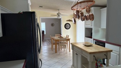 This home has so much to offer!  Pull up to an extended driveway on Sabal Springs Golf and Racquet Club in Florida - for sale on GolfHomes.com, golf home, golf lot