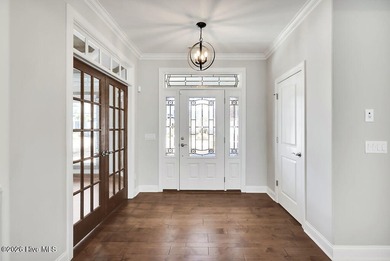 Live the Carolina dream in this all-brick Trusst home perfectly on Compass Pointe Golf Course in North Carolina - for sale on GolfHomes.com, golf home, golf lot