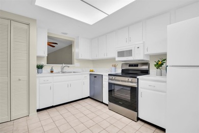 Welcome home to this beautifully updated villa in Villas on the on Highland Lakes Executive Golf Course in Florida - for sale on GolfHomes.com, golf home, golf lot