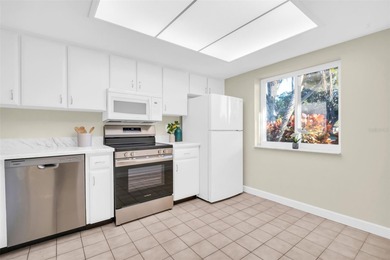 Welcome home to this beautifully updated villa in Villas on the on Highland Lakes Executive Golf Course in Florida - for sale on GolfHomes.com, golf home, golf lot