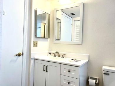 Beautifully nestled ground floor condo among the natural beauty on Country Club At Silver Springs Shores in Florida - for sale on GolfHomes.com, golf home, golf lot
