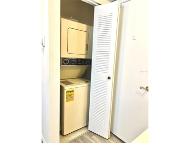 Beautifully nestled ground floor condo among the natural beauty on Country Club At Silver Springs Shores in Florida - for sale on GolfHomes.com, golf home, golf lot