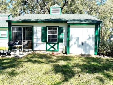 Beautifully nestled ground floor condo among the natural beauty on Country Club At Silver Springs Shores in Florida - for sale on GolfHomes.com, golf home, golf lot