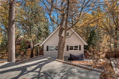 Escape to this stunning 4-bedroom, 3-bathroom mountain cabin on Lake Arrowhead Country Club in California - for sale on GolfHomes.com, golf home, golf lot