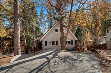 Escape to this stunning 4-bedroom, 3-bathroom mountain cabin on Lake Arrowhead Country Club in California - for sale on GolfHomes.com, golf home, golf lot