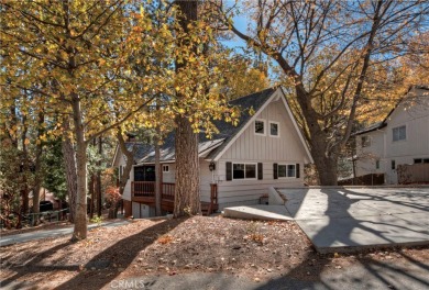 Escape to this stunning 4-bedroom, 3-bathroom mountain cabin on Lake Arrowhead Country Club in California - for sale on GolfHomes.com, golf home, golf lot