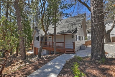 Escape to this stunning 4-bedroom, 3-bathroom mountain cabin on Lake Arrowhead Country Club in California - for sale on GolfHomes.com, golf home, golf lot