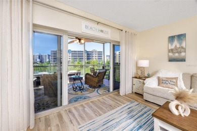 Discover luxury living in this stunning corner condo featuring on East Bay Golf Club in Florida - for sale on GolfHomes.com, golf home, golf lot