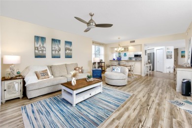 Discover luxury living in this stunning corner condo featuring on East Bay Golf Club in Florida - for sale on GolfHomes.com, golf home, golf lot