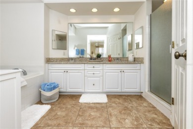 Discover luxury living in this stunning corner condo featuring on East Bay Golf Club in Florida - for sale on GolfHomes.com, golf home, golf lot