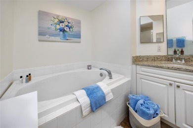 Discover luxury living in this stunning corner condo featuring on East Bay Golf Club in Florida - for sale on GolfHomes.com, golf home, golf lot