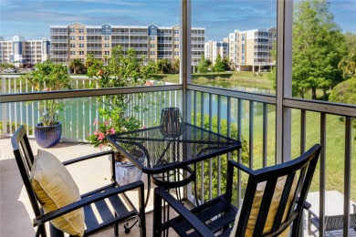 Discover luxury living in this stunning corner condo featuring on East Bay Golf Club in Florida - for sale on GolfHomes.com, golf home, golf lot