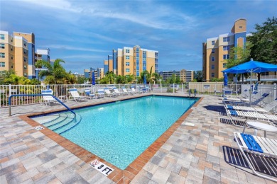 Discover luxury living in this stunning corner condo featuring on East Bay Golf Club in Florida - for sale on GolfHomes.com, golf home, golf lot