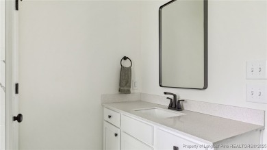Welcome to this meticulously crafted 4-bedroom, 3-bathroom home on Country Club of North Carolina in North Carolina - for sale on GolfHomes.com, golf home, golf lot