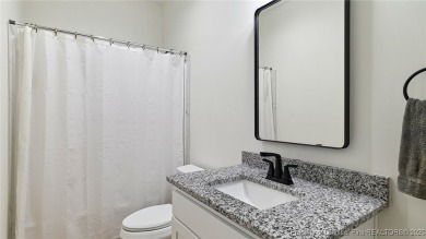 Welcome to this meticulously crafted 4-bedroom, 3-bathroom home on Country Club of North Carolina in North Carolina - for sale on GolfHomes.com, golf home, golf lot