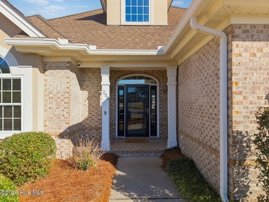 Step into this beautifully designed 3-bedroom, 2-bath home in on Ocean Ridge Plantation in North Carolina - for sale on GolfHomes.com, golf home, golf lot
