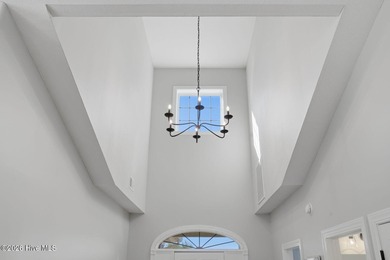 Step into this beautifully designed 3-bedroom, 2-bath home in on Ocean Ridge Plantation in North Carolina - for sale on GolfHomes.com, golf home, golf lot