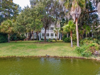 The pond view is breathtaking! This Low Country 5 bedroom, 5 on DeBordieu Country Club in South Carolina - for sale on GolfHomes.com, golf home, golf lot