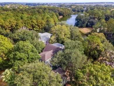 The pond view is breathtaking! This Low Country 5 bedroom, 5 on DeBordieu Country Club in South Carolina - for sale on GolfHomes.com, golf home, golf lot