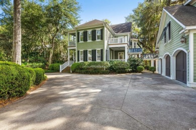 The pond view is breathtaking! This Low Country 5 bedroom, 5 on DeBordieu Country Club in South Carolina - for sale on GolfHomes.com, golf home, golf lot