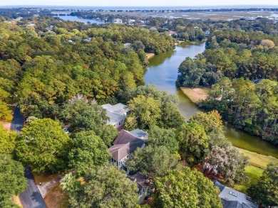 The pond view is breathtaking! This Low Country 5 bedroom, 5 on DeBordieu Country Club in South Carolina - for sale on GolfHomes.com, golf home, golf lot