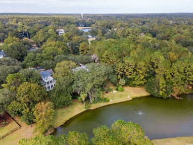 The pond view is breathtaking! This Low Country 5 bedroom, 5 on DeBordieu Country Club in South Carolina - for sale on GolfHomes.com, golf home, golf lot