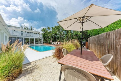 Discover Mia Bella -- a rare canal-front estate on Anna Maria on Key Royale Club in Florida - for sale on GolfHomes.com, golf home, golf lot