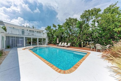 Discover Mia Bella -- a rare canal-front estate on Anna Maria on Key Royale Club in Florida - for sale on GolfHomes.com, golf home, golf lot