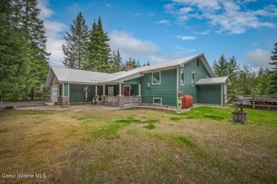 This impeccably maintained Priest Lake home perfectly blends on Priest Lake Golf and Tennis Club in Idaho - for sale on GolfHomes.com, golf home, golf lot