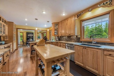 This impeccably maintained Priest Lake home perfectly blends on Priest Lake Golf and Tennis Club in Idaho - for sale on GolfHomes.com, golf home, golf lot